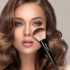 Aardlig AuraBrush used on model's face for flawless makeup application and natural airbrush effect.