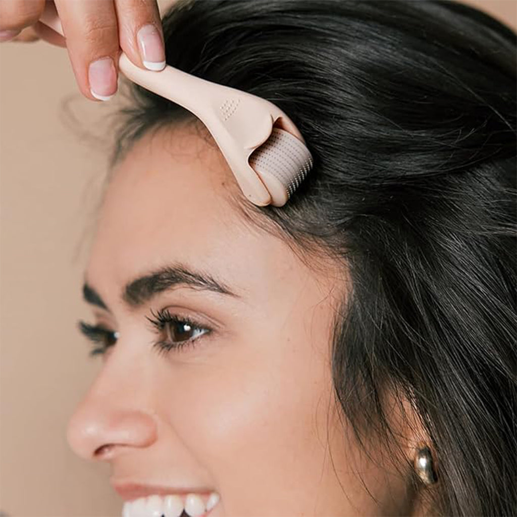 Aardlig DermaGlow micro-needling roller in use for enhanced skincare and smoother skin appearance.