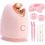 Aardlig PureSteam facial steamer in pink with skincare tools and accessories for improved skincare routine.